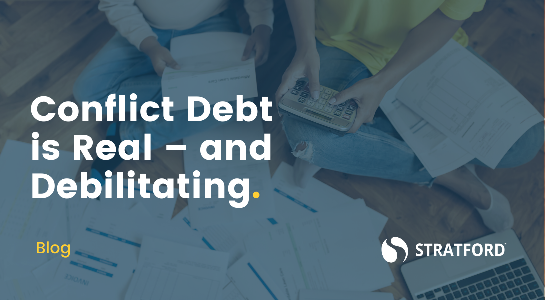 Two people cross-legged on floor surrounded by papers & a laptop with one holding a calculator. Text overlay "Conflict Debt is Real-and Debilitating"