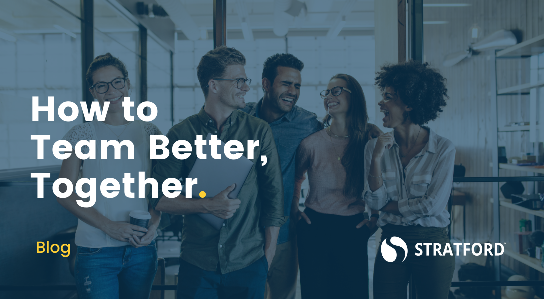 Row of smiling colleagues standing shoulder to shoulder with text overlay "How to Team Better Together."